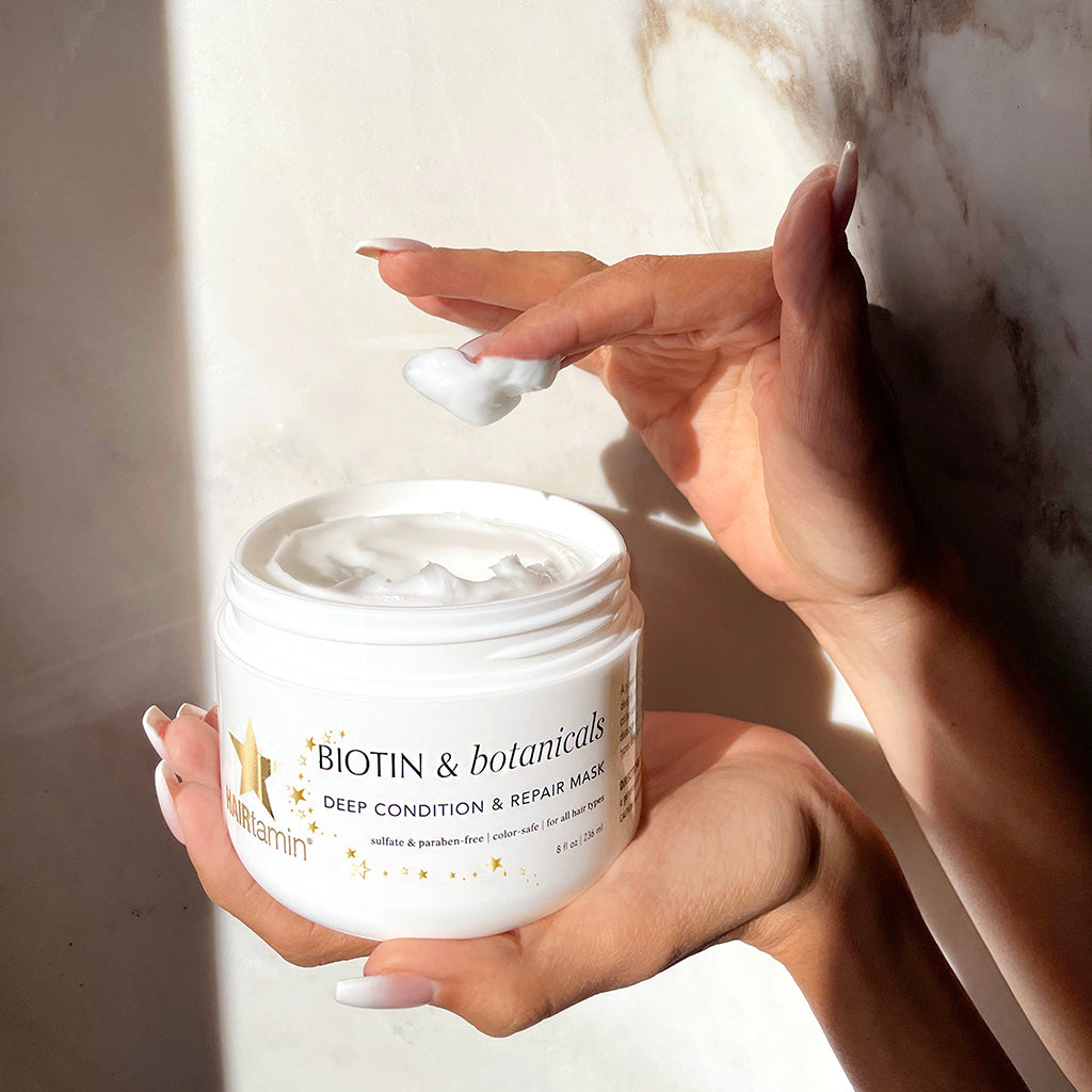Hair mask container in hand
