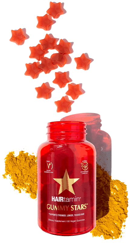gummy stars spilled out of bottle with turmeric
