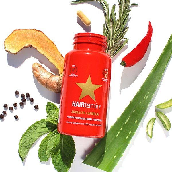 Advanced formula bottle surrounded by fresh ingredients