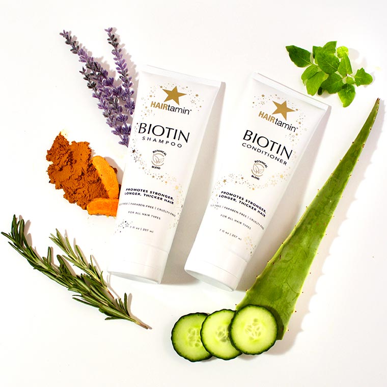 biotin shampoo and conditioner surrounded by ingredients